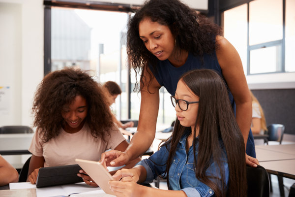 young girls learning in a classroom